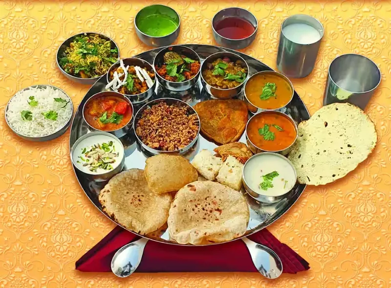 Traditional Gujarati thali with farsan and sweets