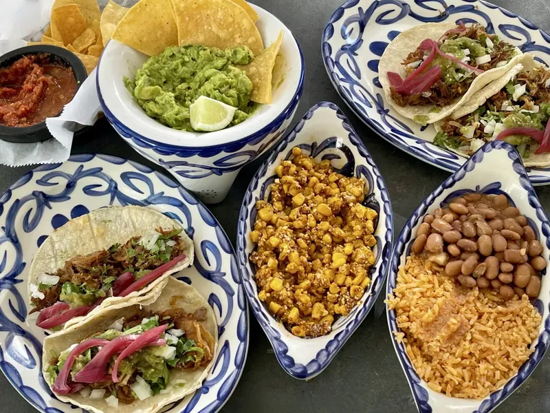 Vibrant Mexican spread with tacos and salsa